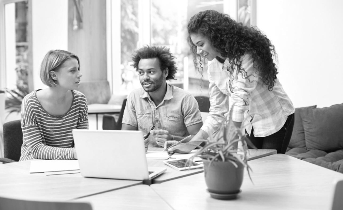 Instructor reviewing trading concepts with learning materials